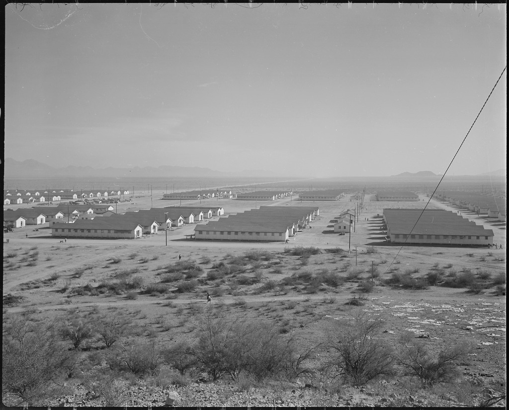 Landscape shot of barracks laid out in rows at Gila River concentration camp.