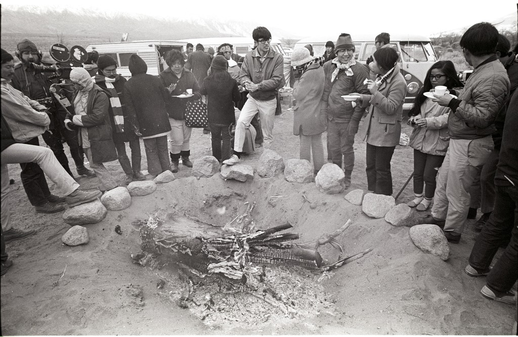 People gathered around a bonfire during the 1969 Manzanar Pilgrimage.