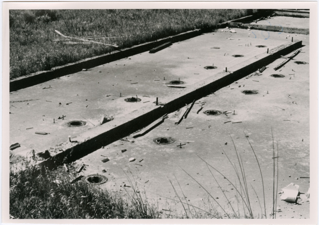 Toilet sewer holes in the foundation of a former latrine at Tule Lake.