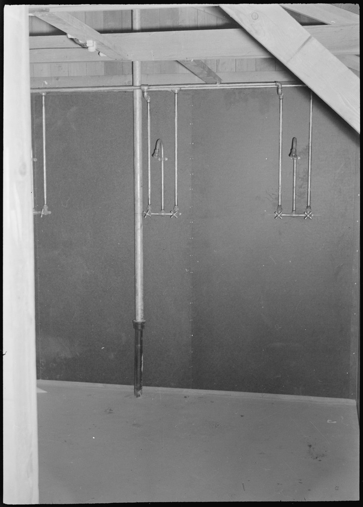 Shower heads inside the latrines at Poston concentration camp.